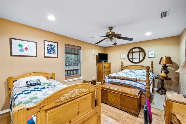 bedroom featuring ceiling fan and light hardwood / wood-style floors