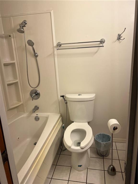 2618 Diberville Dr N, Mobile, AL 36695 - full bathroom with tile patterned flooring,  shower combination, and toilet