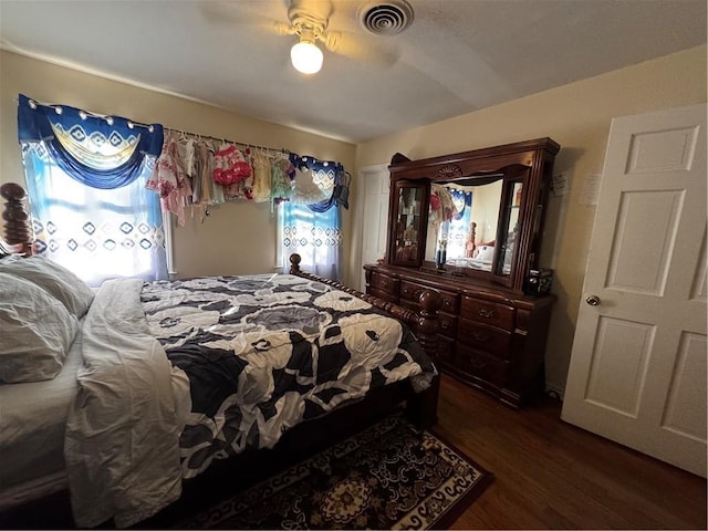 bedroom featuring ceiling fan and dark wood-type flooring