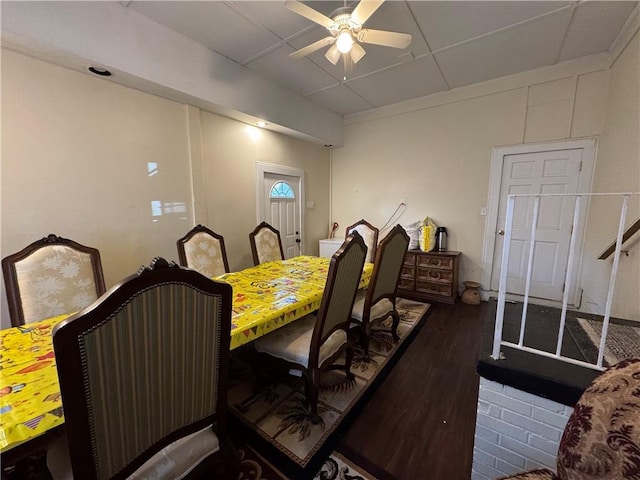 dining space featuring ceiling fan and dark hardwood / wood-style flooring