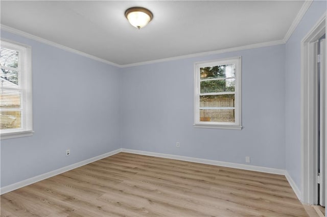 spare room with crown molding and light hardwood / wood-style floors