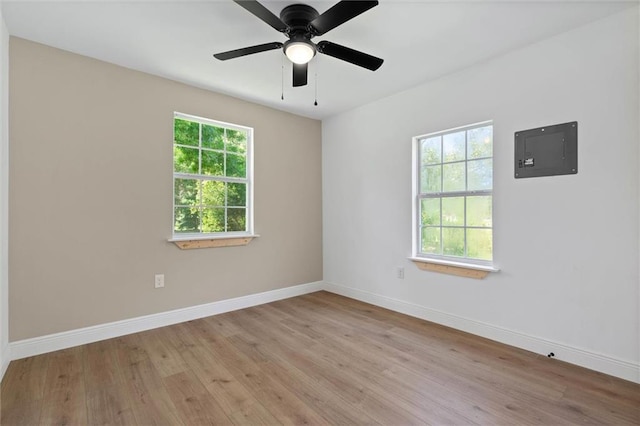 8520 Lebaron Ave W, Citronelle, AL 36522 - spare room featuring electric panel, wood finished floors, and ceiling fan