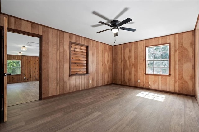 8520 Lebaron Ave W, Citronelle, AL 36522 - spare room with wood finished floors, ceiling fan, and wooden walls