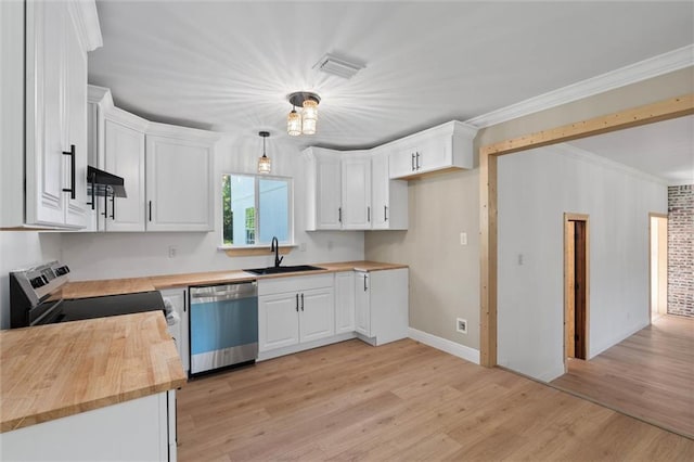 8520 Lebaron Ave W, Citronelle, AL 36522 - kitchen with appliances with stainless steel finishes, wood counters, white cabinetry, light wood-type flooring, and ornamental molding