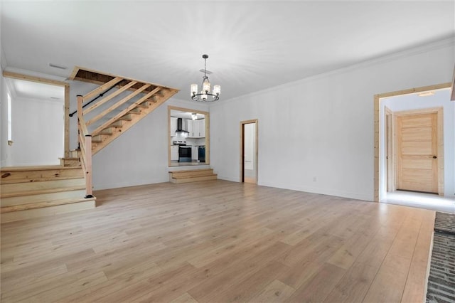 8520 Lebaron Ave W, Citronelle, AL 36522 - unfurnished living room with ornamental molding, light wood finished floors, stairs, and a chandelier