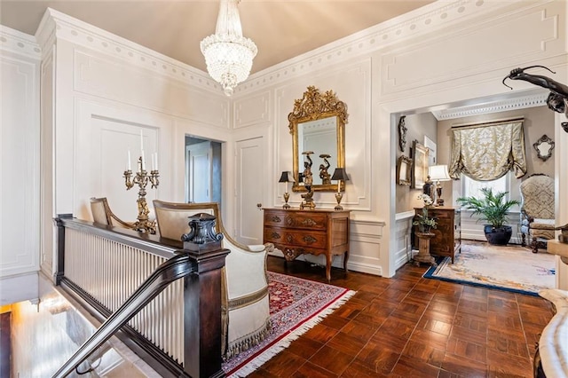 interior space featuring a decorative wall and a chandelier