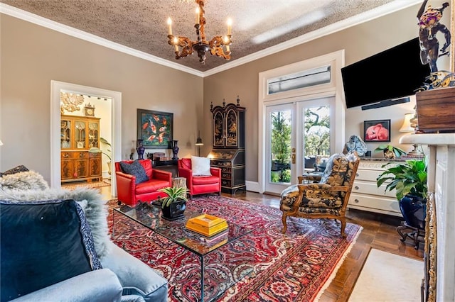 living room featuring a notable chandelier, a textured ceiling, and ornamental molding