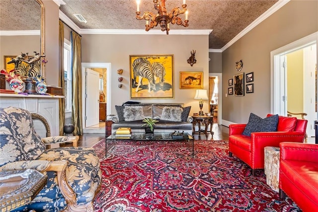 living area featuring visible vents, a textured ceiling, an inviting chandelier, and ornamental molding