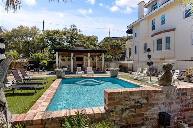 view of swimming pool featuring a gazebo, a fenced in pool, a patio area, and fence