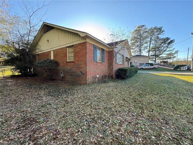 view of property exterior with a lawn