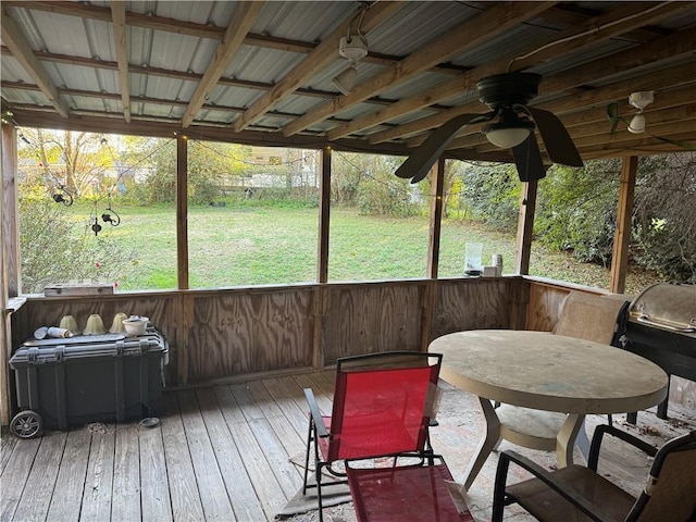 sunroom / solarium featuring ceiling fan and a healthy amount of sunlight