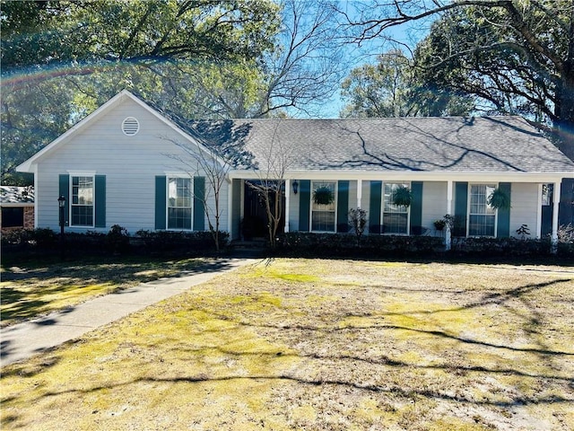 ranch-style home with a front lawn