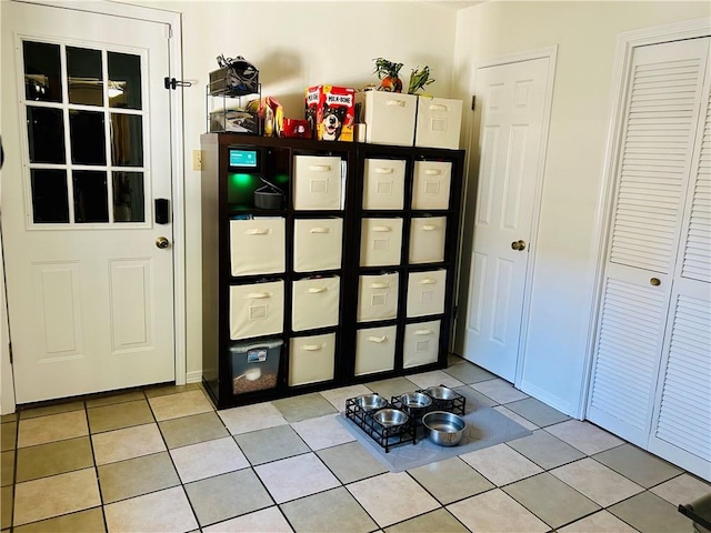 entryway with light tile patterned floors