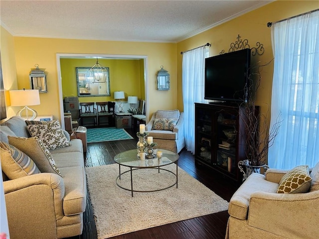 living area featuring dark wood-style floors and crown molding