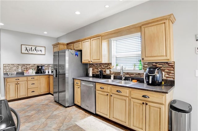 kitchen with sink, light brown cabinets, and appliances with stainless steel finishes