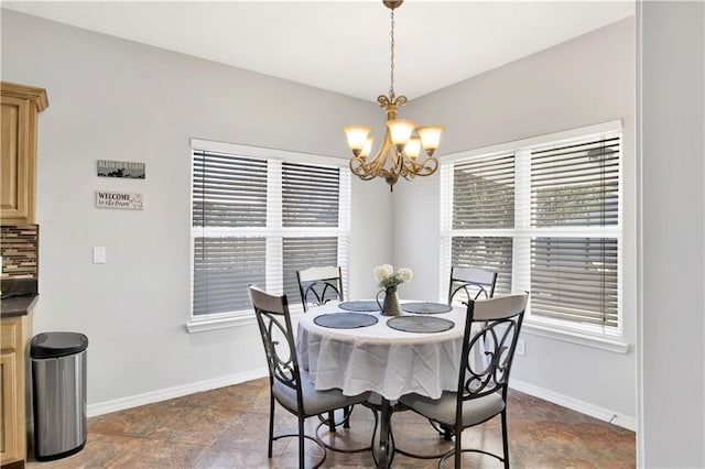 dining space featuring an inviting chandelier