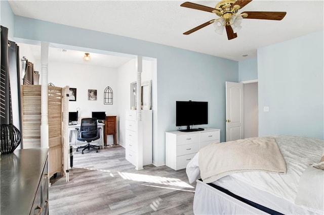 bedroom with ceiling fan and light hardwood / wood-style flooring