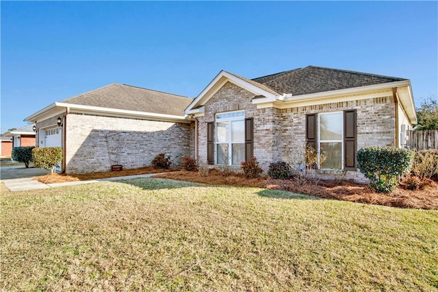 view of front facade featuring a garage and a front lawn