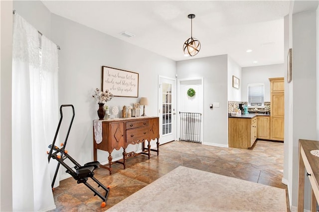 entrance foyer with a wealth of natural light and french doors