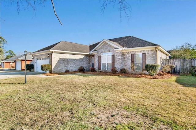 single story home featuring a garage and a front lawn