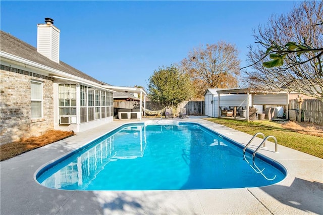 view of pool featuring a patio and an outdoor structure