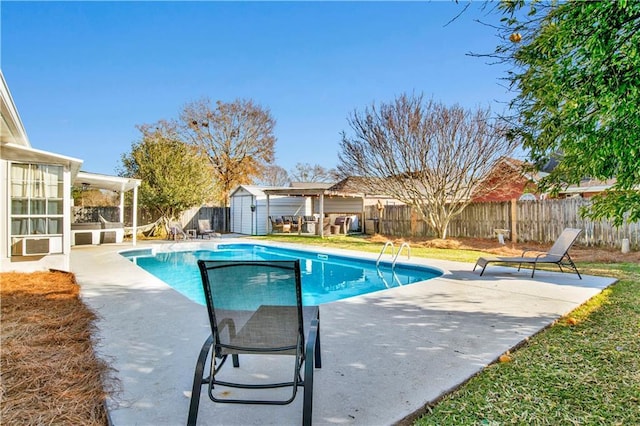 view of pool with a storage shed, a sunroom, and a patio