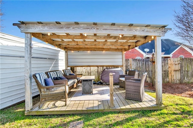 view of patio / terrace with an outdoor living space, a wooden deck, and a pergola