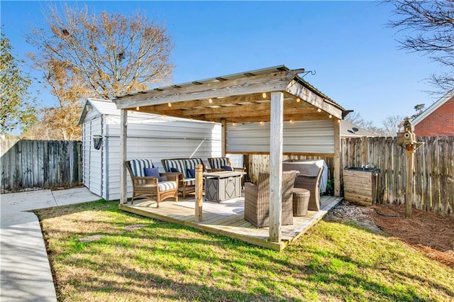 exterior space featuring a yard, an outdoor hangout area, and a shed