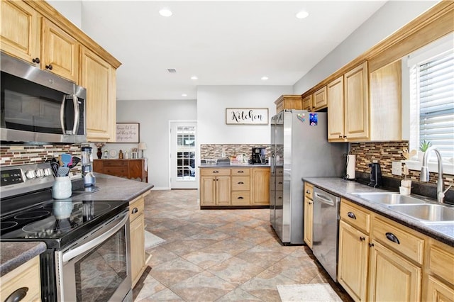 kitchen with sink, light brown cabinets, and appliances with stainless steel finishes