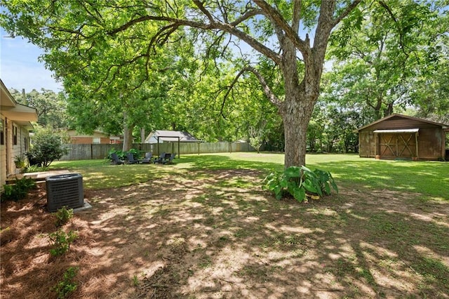 4950 Santos Dr E, Mobile, AL 36619 - view of yard featuring cooling unit and an outbuilding