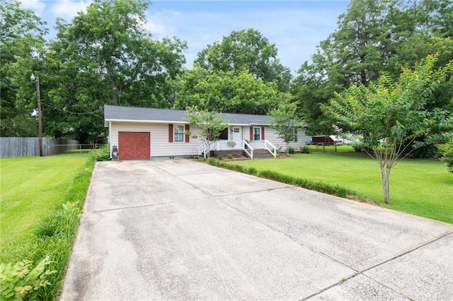4950 Santos Dr E, Mobile, AL 36619 - ranch-style home with driveway and an attached garage