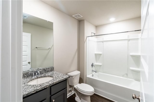 full bath with toilet, visible vents, tub / shower combination, and vanity