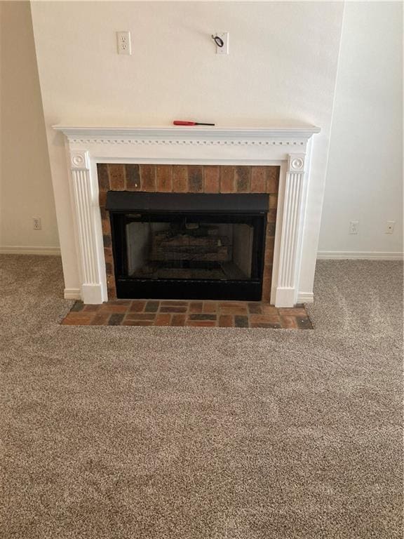 details with a tile fireplace and carpet flooring