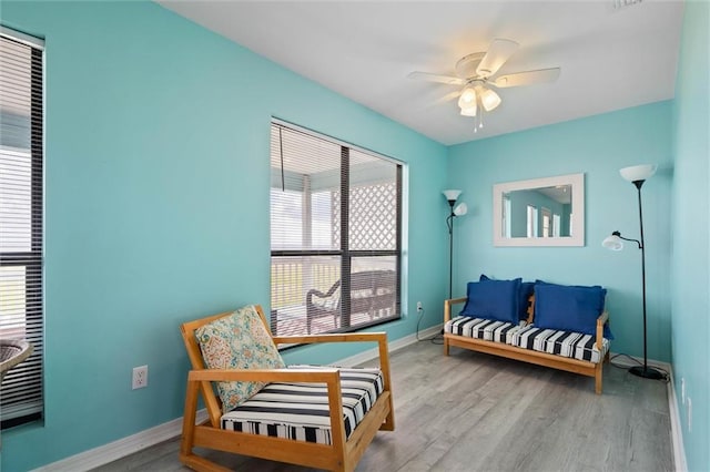 2528 Bridgeview Dr, Dauphin Island, AL 36528 - living area featuring healthy amount of natural light, wood finished floors, and a ceiling fan