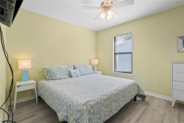 2528 Bridgeview Dr, Dauphin Island, AL 36528 - bedroom with wood finished floors and ceiling fan
