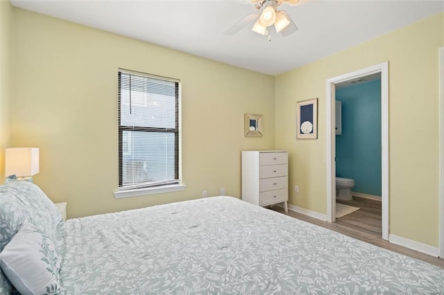 2528 Bridgeview Dr, Dauphin Island, AL 36528 - bedroom featuring wood finished floors, ensuite bathroom, and a ceiling fan