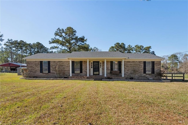 ranch-style house with brick siding, crawl space, a front yard, and fence