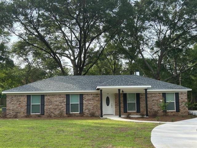13580 Laco Cooper Rd, Wilmer, AL 36587 - ranch-style house featuring a front yard and brick siding