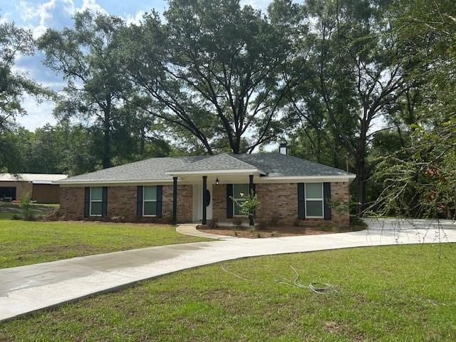 13580 Laco Cooper Rd, Wilmer, AL 36587 - ranch-style home featuring driveway, a front lawn, and brick siding