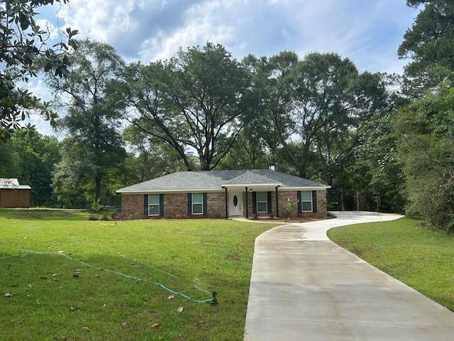 13580 Laco Cooper Rd, Wilmer, AL 36587 - ranch-style house with concrete driveway and a front yard