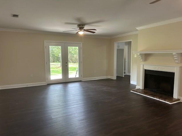 13580 Laco Cooper Rd, Wilmer, AL 36587 - unfurnished living room featuring a ceiling fan, ornamental molding, dark wood-style floors, french doors, and baseboards