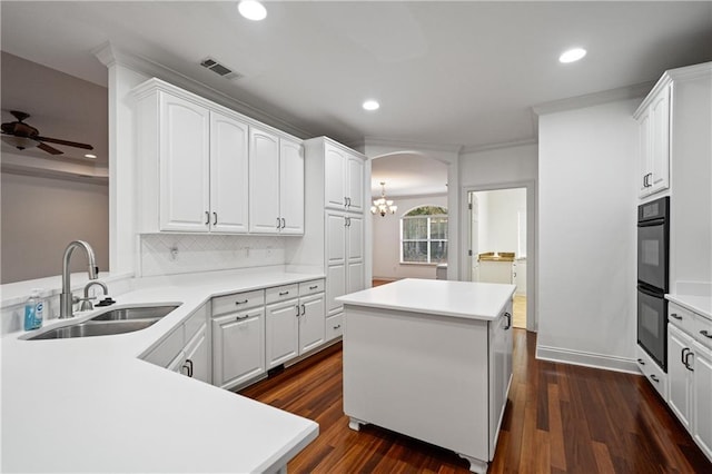 404 Savannah Ln, Foley, AL 36535 - kitchen featuring white cabinets, visible vents, light countertops, and a sink