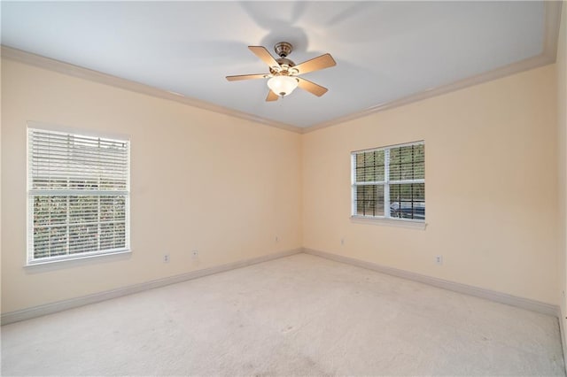 404 Savannah Ln, Foley, AL 36535 - empty room featuring light carpet, a healthy amount of sunlight, baseboards, and crown molding