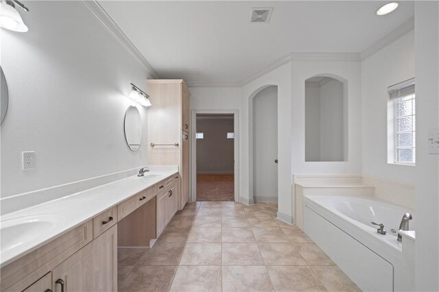 404 Savannah Ln, Foley, AL 36535 - bathroom with a garden tub, crown molding, double vanity, visible vents, and tile patterned floors