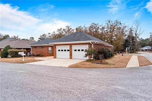 404 Savannah Ln, Foley, AL 36535 - view of front of property with an attached garage, concrete driveway, and brick siding
