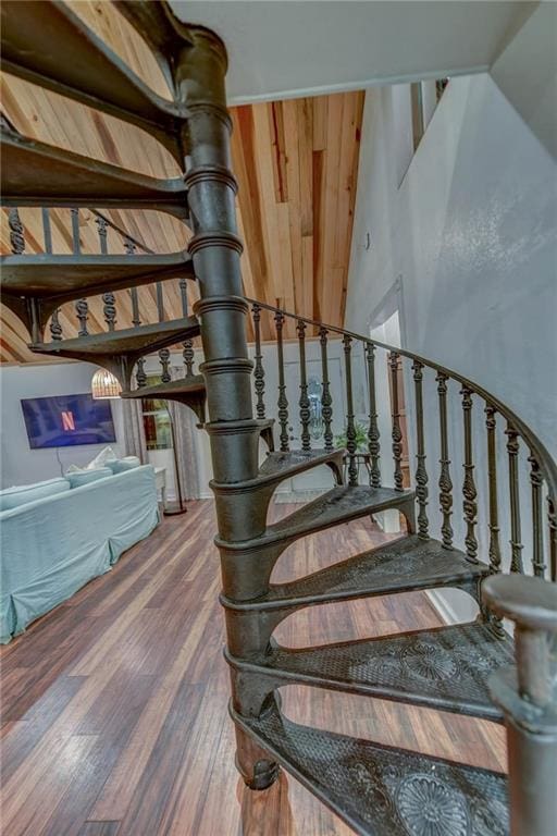 stairs featuring wood-type flooring