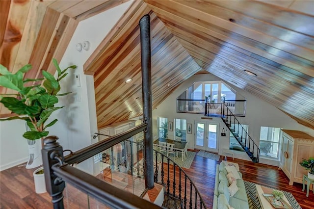 interior space with high vaulted ceiling, hardwood / wood-style flooring, wooden ceiling, and french doors