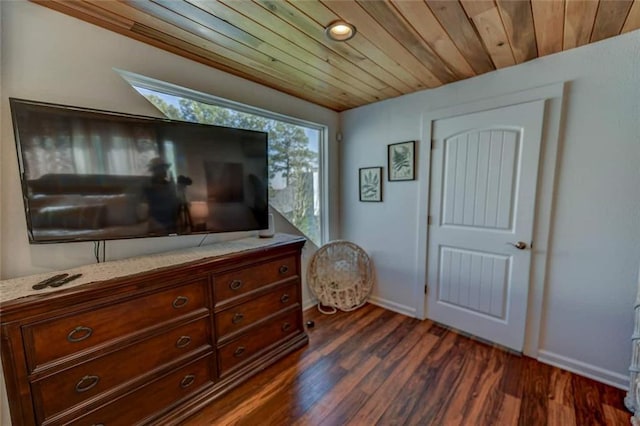 bedroom with dark hardwood / wood-style floors and wood ceiling