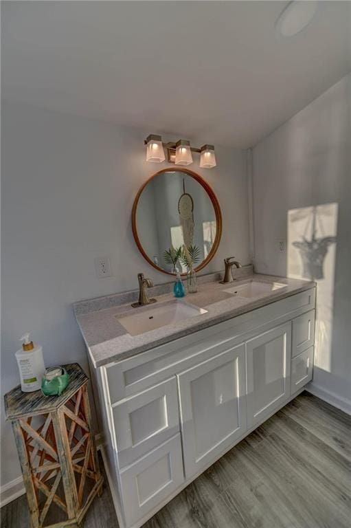 bathroom featuring vanity and hardwood / wood-style floors