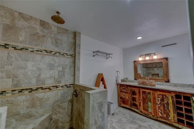 bathroom featuring vanity and a tile shower